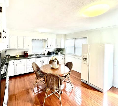 Full sized kitchen with dining table seating for four, gas cook top, dishwasher, and traditional drip coffee maker!