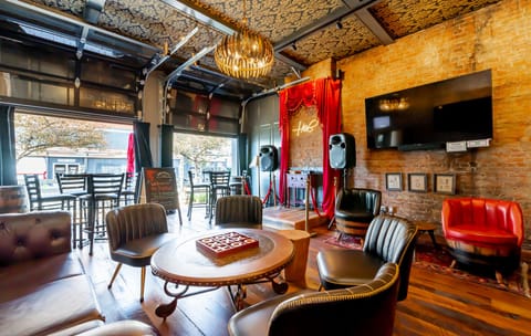 The speakeasy lounge awaits you. Open the garage doors in beautiful weather so the passer buyers can applaud your karaoke magic!