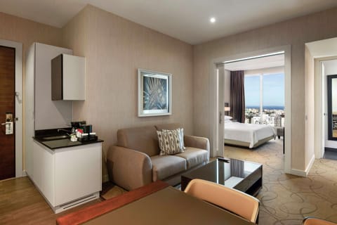 Suite, 1 Bedroom | Living area | 37-inch flat-screen TV with premium channels, TV, iPod dock