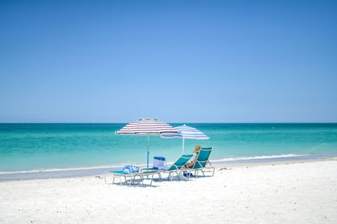 On the beach, white sand, beach towels