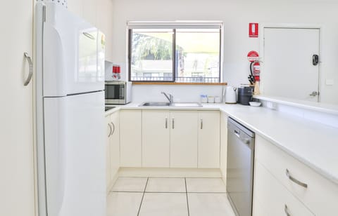Deluxe Apartment, 2 Bedrooms | Private kitchen | Fridge, microwave, coffee/tea maker, electric kettle