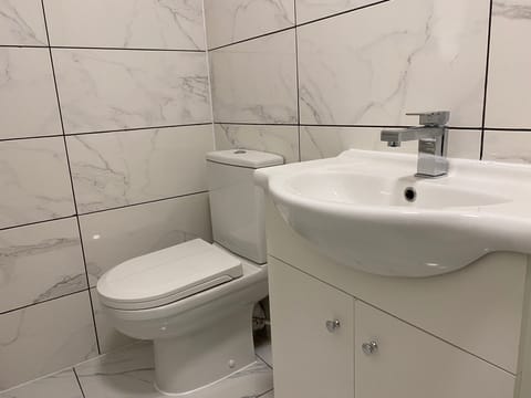 Bright bathroom with all necessary equipments.