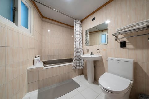 Premium Twin Room | Bathroom | Designer toiletries, hair dryer, bathrobes, slippers