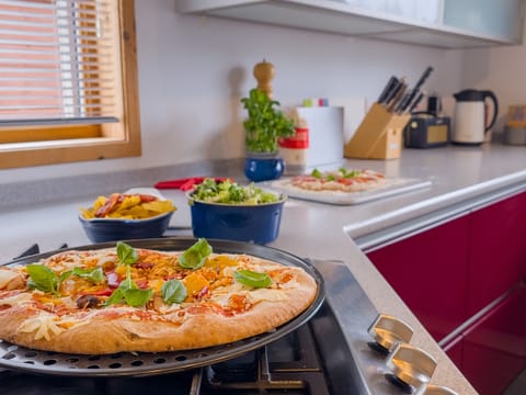 The modern kitchen has gas hob and double oven