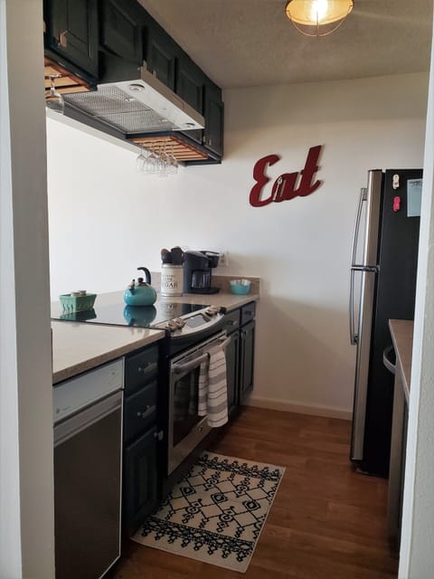 A refrigerator, dishwasher, stove/oven, and microwave are all included.