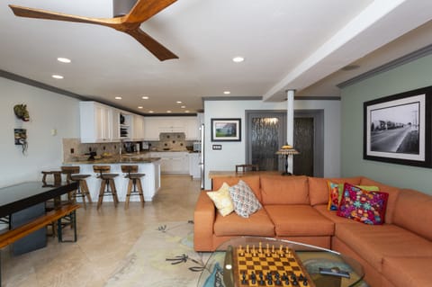 The living room has plenty of seating to gather with the family.