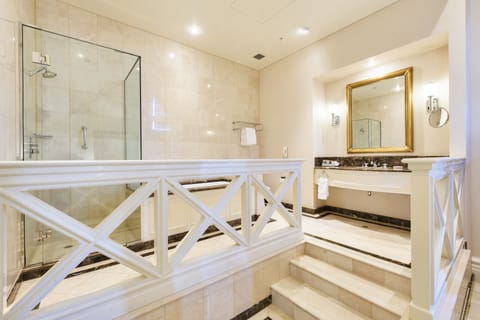 Suite, 1 King Bed | Bathroom | Shower, free toiletries, hair dryer, bathrobes