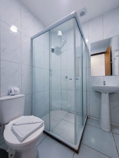 Standard Triple Room, 1 Bedroom | Bathroom | Rainfall showerhead, free toiletries, hair dryer, towels