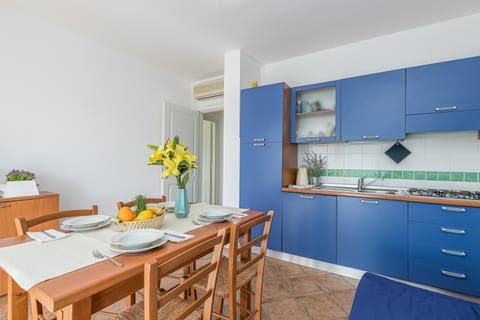 Family Apartment, 2 Bedrooms, 2 Bathrooms (Le Dimore di Nettuno 2 With Pool) | Private kitchen | Fridge, microwave, stovetop, dishwasher