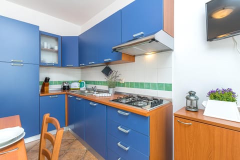 Family Apartment, 2 Bedrooms, 2 Bathrooms (Le Dimore di Nettuno 3 With Pool) | Private kitchen | Fridge, microwave, stovetop, dishwasher