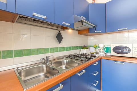 Family Apartment, 2 Bedrooms, 2 Bathrooms (Le Dimore di Nettuno 1 With Pool) | Private kitchen | Fridge, microwave, stovetop, dishwasher