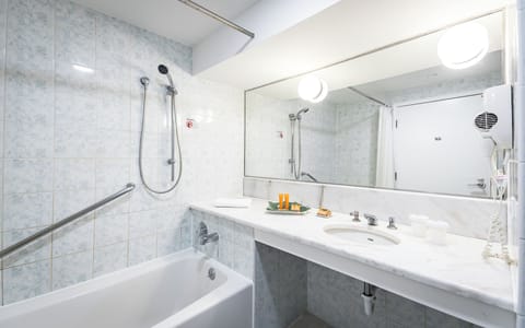 Bathtub, deep soaking tub, eco-friendly toiletries, hair dryer