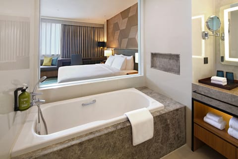 Suite, 1 King Bed | Bathroom | Eco-friendly toiletries, hair dryer, slippers, bidet