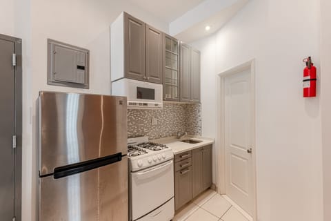 Apartment | Private kitchen | Full-size fridge, microwave, oven, stovetop