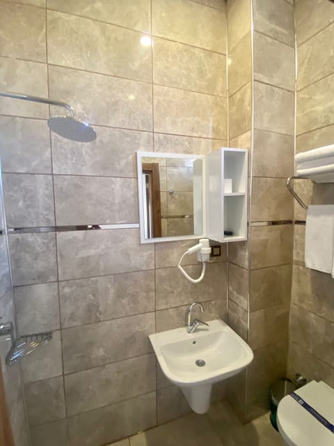 Economy Triple Room, Multiple Beds, Accessible, Non Smoking | Bathroom | Shower, rainfall showerhead, hair dryer, bathrobes