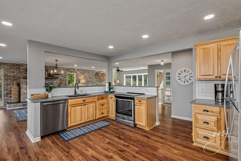 Kitchen opens to living room and dining room