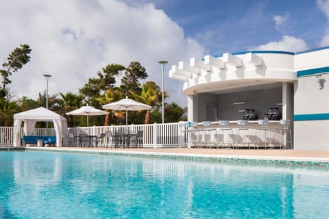 Outdoor pool, open 7:00 AM to 11:00 PM, free cabanas, pool umbrellas