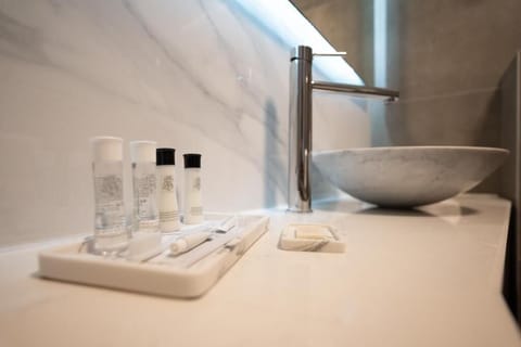 Shower, rainfall showerhead, hair dryer, towels