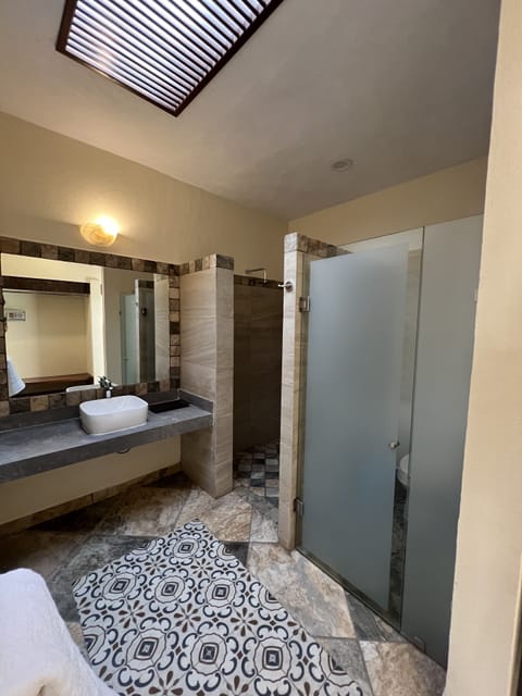 Master King suite, upper floor | Bathroom | Shower, rainfall showerhead, towels, soap