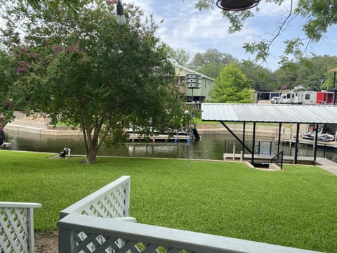 Backyard along channel. Boat slips in use by owners.