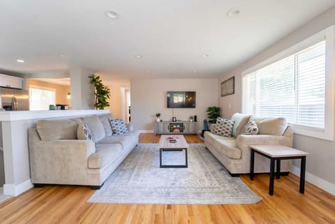 The living room has 2 comfy sofas and a large HD TV