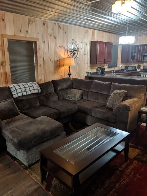 Living Room has large couch with plenty of seating and room for 2 to sleep.