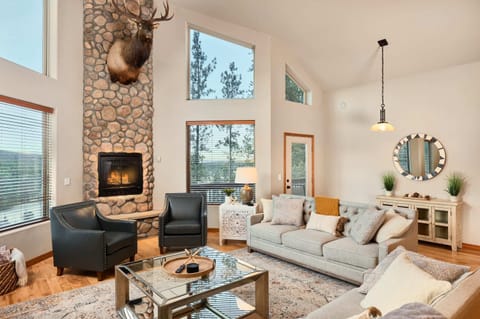 Living Room 1- sofas, fireplace, access to balcony, tv (upstairs)