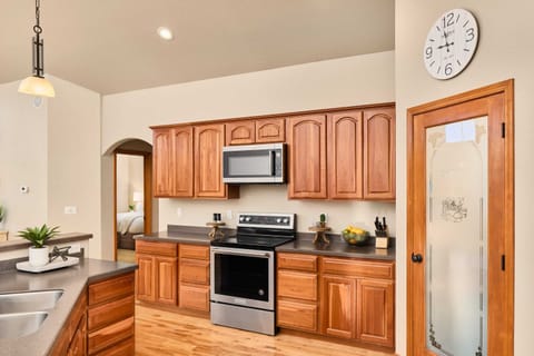 Kitchen with island, microwave, oven, fridge, coffee station, pantry (upstairs)