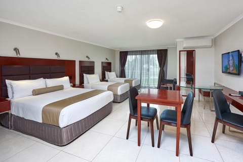 Deluxe Room, Multiple Beds, Non Smoking, Balcony | In-room safe, desk, laptop workspace, soundproofing