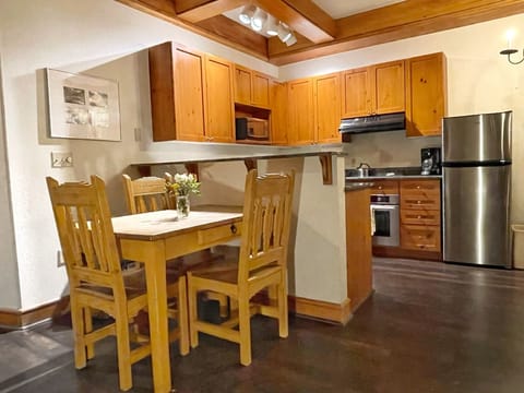 Fully functional kitchen with table seating up to 4. 