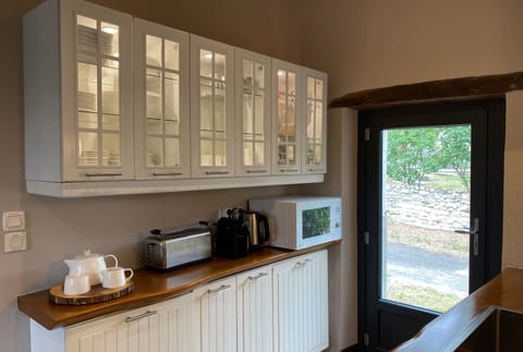 Small appliances include a toaster, Nespresso, electric kettle, microwave + more