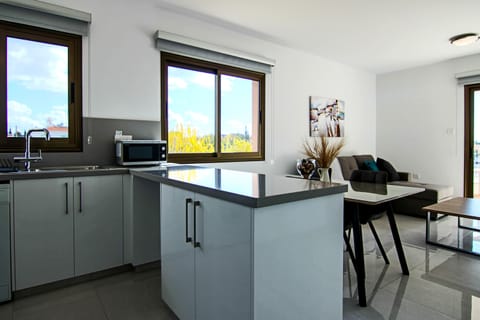 Luxury Apartment | Private kitchen | Fridge, coffee/tea maker, dining tables