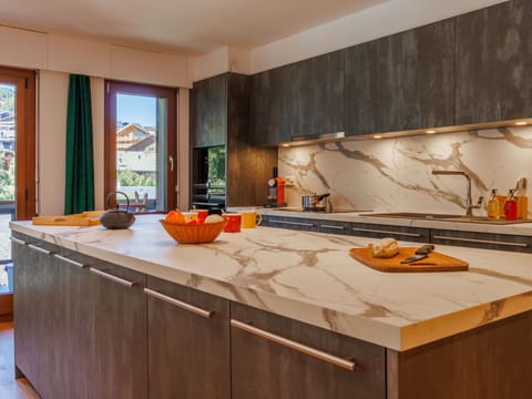 Wood, Flooring, Kitchen, Countertop, Interior Design, Floor, Cabinetry, Furniture, Kitchen Appliance, Wood Stain