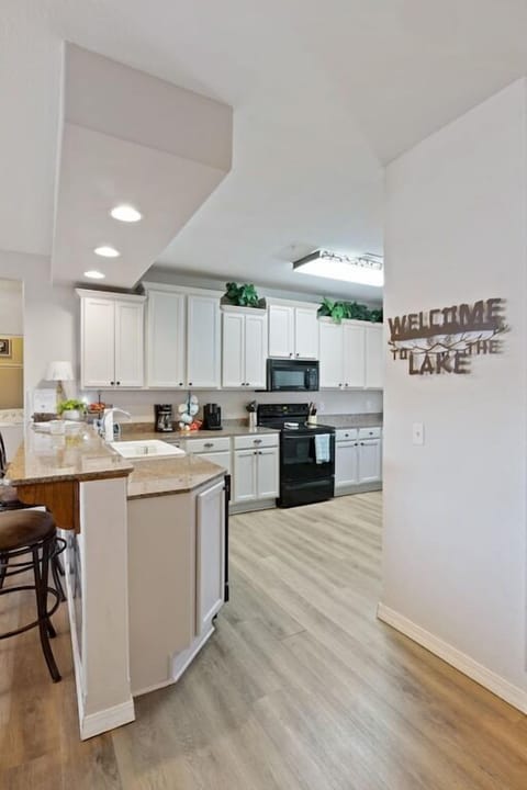 Large kitchen stocked with appliances, cookware and utensils