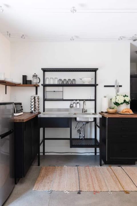 Elevated kitchenette with an extra large mini fridge with freezer