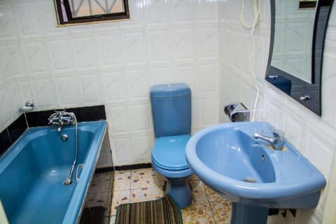 Standard Double Room | Bathroom | Combined shower/tub, rainfall showerhead, towels
