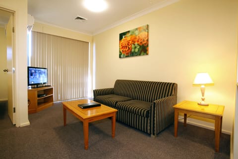 Apartment, 1 Bedroom | Living area | 32-inch flat-screen TV with digital channels, TV