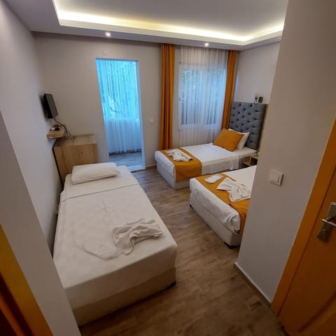 Standard Triple Room | Premium bedding, laptop workspace, free WiFi, bed sheets