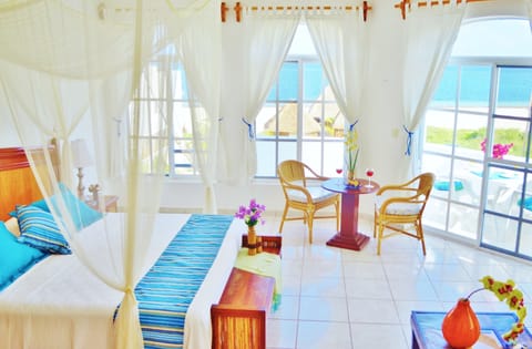 Deluxe Suite, 1 Bedroom, Kitchen, Partial Ocean View | Free WiFi, bed sheets