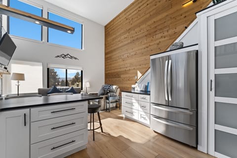 Updated full-size kitchen with stainless steel appliances and new countertops.