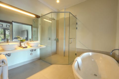 Suite, Pool View | Bathroom | Combined shower/tub, deep soaking tub, free toiletries, hair dryer