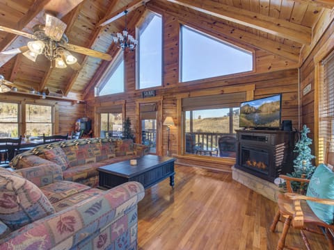 Cabin, Multiple Beds, Balcony | Living area | 40-inch TV with cable channels, fireplace