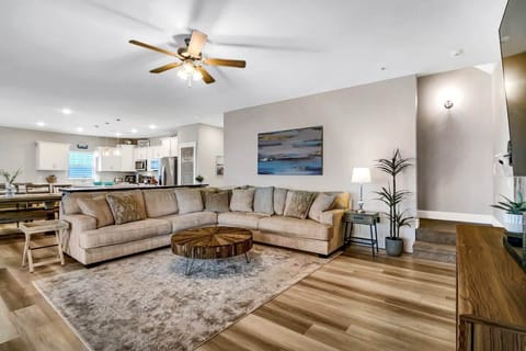 The spacious living room has an open floor plan and plenty of seating for all!