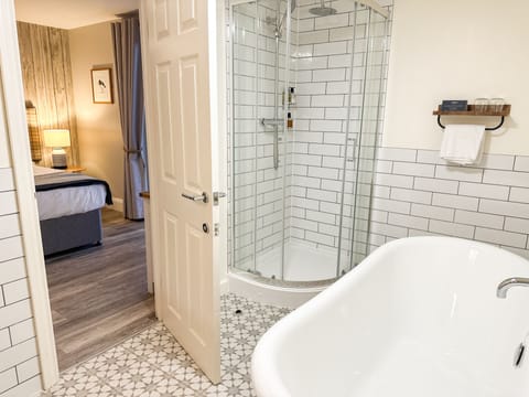 Deluxe Room | Bathroom | Designer toiletries, hair dryer, towels, soap