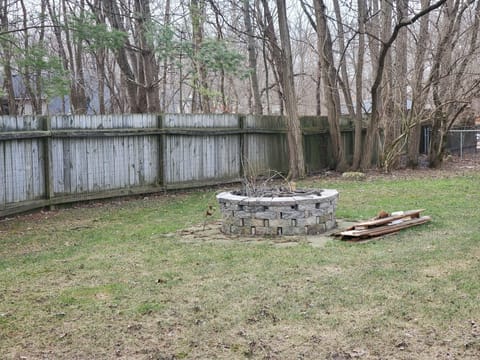 Fully fenced yard with firepit