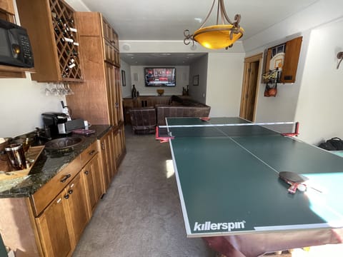 Media room with ping-pong, pop a shot, wet bar