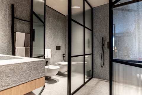 Suite | Bathroom | Rainfall showerhead, eco-friendly toiletries, hair dryer, bathrobes