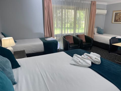 Deluxe Quadruple Room, Golf View | Premium bedding, pillowtop beds, desk, laptop workspace