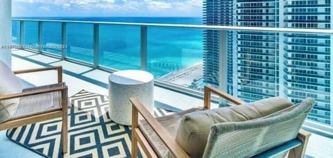 Large size glass balcony with swinging. Hammock chair