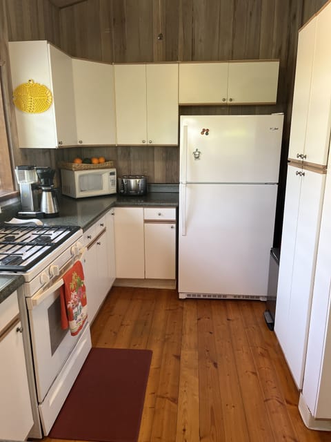 Equipped with coffee pot, microwave, toaster, blender, rice maker, slow cooker.